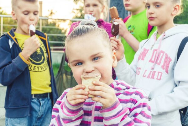 A group of children enjoying ice cream aided by social narratives